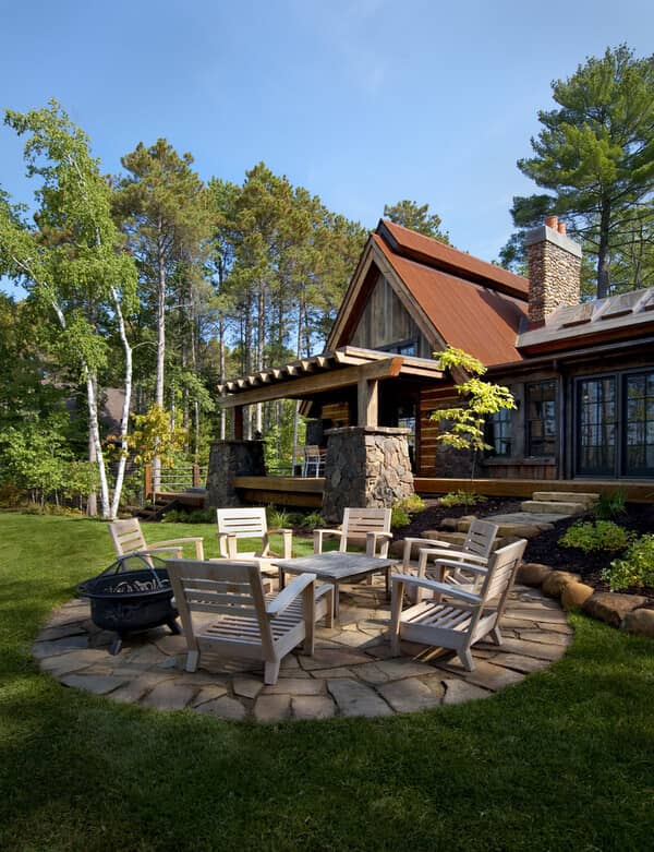 Rustic wood exterior home idea in Minneapolis