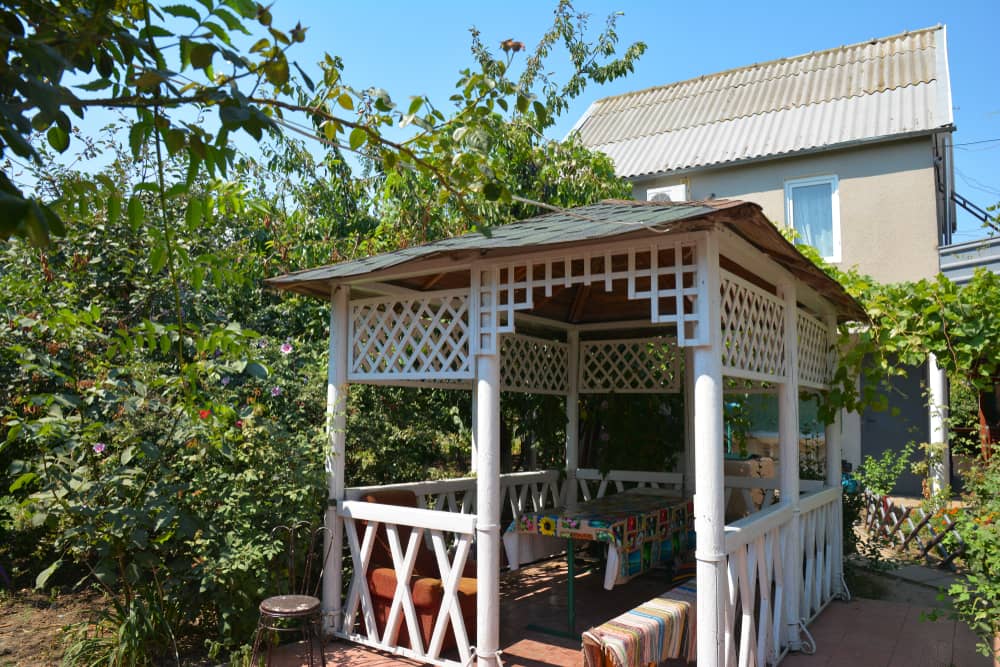 Beautiful alcove, wooden arbor, pavilion, bower, summer house, garden house in the garden