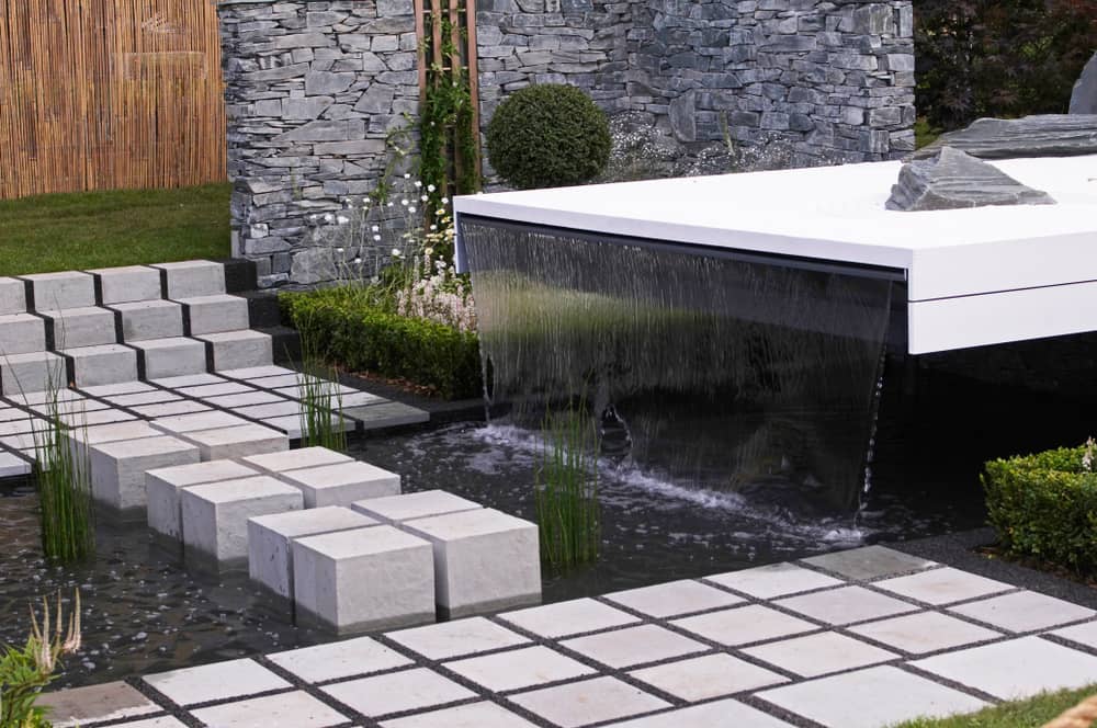 A modern water garden with stepping stones