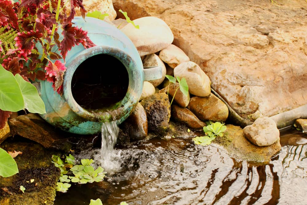 Clay water feature near a pond