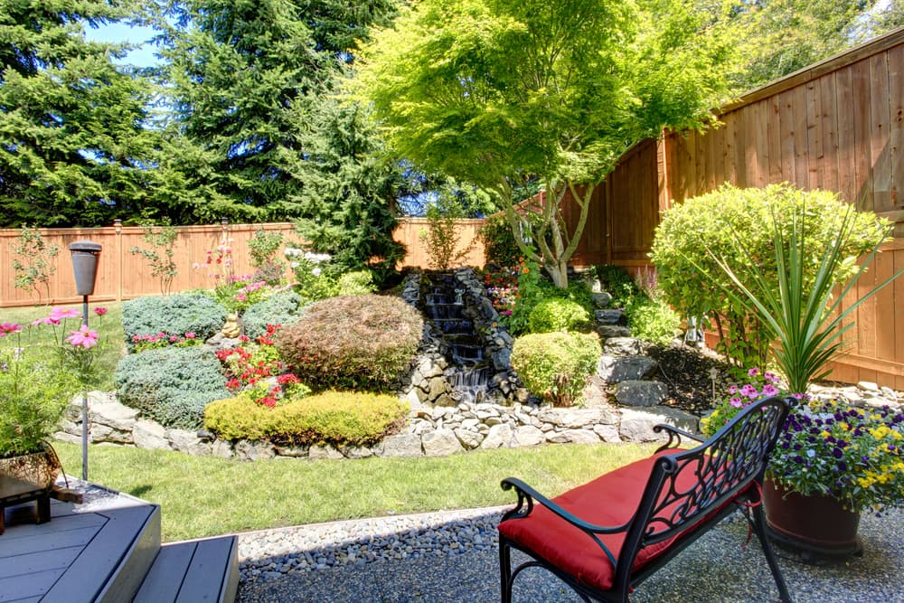 garden with rock border and waterfall