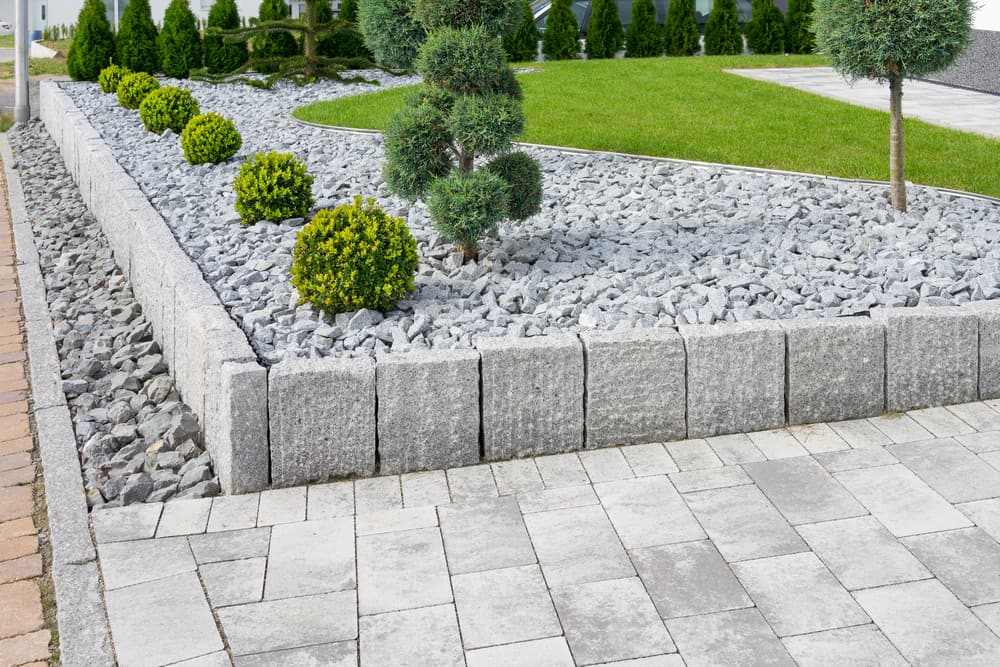 white-rock-with-green-shrubs