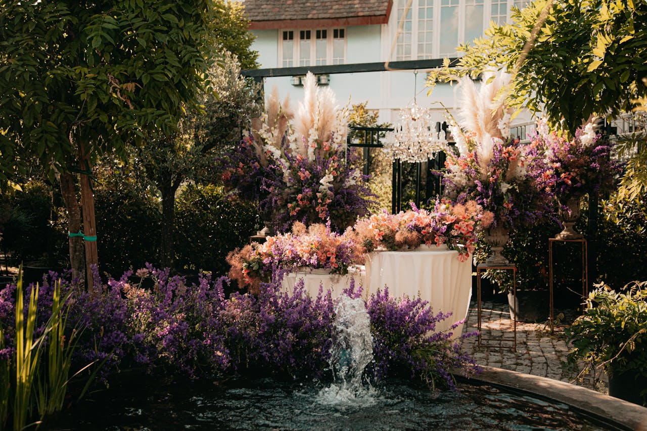 Flowers near a water fountain in the day time