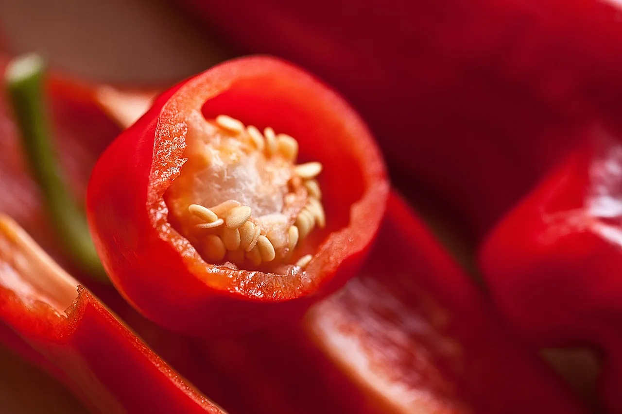 Red pepper seeds inside peppers