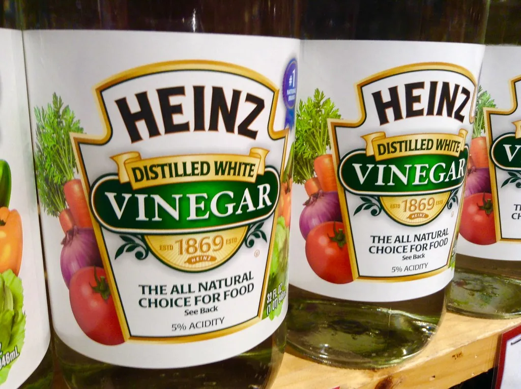 A row of white vinegar bottles